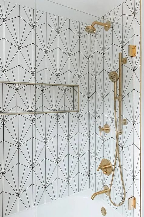 A dreamy bright shower with a modern pivoting glass shower shield and beautiful brass hardware makes anyone want to take a mid-day shower getaway. Geometric Tiles Bathroom, Small Bathroom Sinks, Modern Basement, Art Deco Bathroom, Bathroom Redesign, Bathroom Shower Tile, Geometric Tiles, Hexagon Tiles, Bathroom Wall Tile