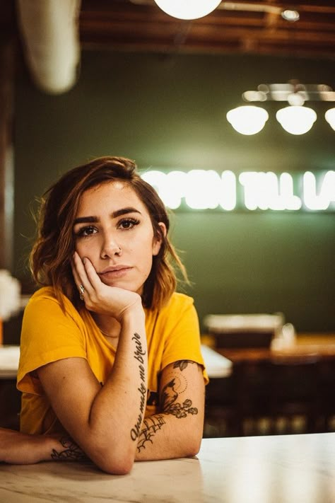 woman wearing yellow crew-neck shirt sitting beside table posing for photo Latest Background, Anatomy Poses, Background Wallpapers, Sitting Poses, Pic Pose, Instagram Ideas Photography, Human Poses Reference, Portrait Photography Poses, Figure Poses