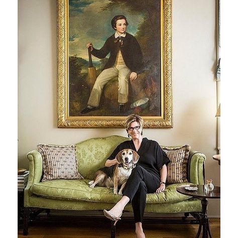 Julia Reed and her beagle, Henry. The regal English oil painting of a cricket player above Julia’s sofa hung in the Nashville home of her great-grandmother “forever, and I don’t think anybody ever paid attention to it, and I always lucky enough to have the highest ceilings, so it got passed to me,” she says. “I can’t imagine what possessed her to buy that—it’s certainly not an ancestor—but I’m happy to have it.” Photo by Lesley Unruh. From onekingslane.com. Julia Reed, New Orleans Apartment, Historic Home Interiors, New Orleans Garden District, Hand Painted Table, New Orleans Homes, Large Armchair, Historic Home, Southern Charm