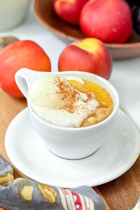 This Peach Mug Cake is a delicious way to enjoy a version of peach cobbler, in 3 to 4 minutes. It's decadently delicious and easy to make with a few pantry ingredients. So the next time peach cravings arise, try this fluffy and warm peach mug cake! Easy Single Serve Peach Cobbler, Peach Mug Cake, Peach Crisp In A Mug, Mug Peach Cobbler, Microwave Peach Crisp, 10 Minute Gooey Vanilla Peach Mug Cake, Cake Microwave, Mug Cake Microwave, Baked Peach