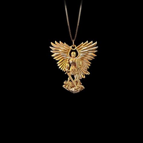 Embrace divine protection with the Gold St. Michael Pendant. Crafted in radiant Gold, this pendant features St. Michael, the archangel known for his role as a protector and warrior. The intricate design highlights his iconic image, making it a powerful accessory for those seeking a symbol of strength and guidance. 𝗣𝗲𝗻𝗱𝗮𝗻𝘁 𝗱𝗲𝘁𝗮𝗶𝗹𝘀 This pendant is crafted in real solid gold. * Made in USA * 𝗛𝗲𝗶𝗴𝗵𝘁: 1.23" (31 mm) x 𝗪𝗶𝗱𝘁𝗵: 1.1" (28 mm)  *not including the bail dimensions * 𝗠𝗮𝘁𝗲𝗿𝗶𝗮𝗹: 14K and 18K solid gold * 𝗙𝗶𝗻𝗶𝘀𝗵: polished * 𝗪𝗲𝗶𝗴𝗵𝘁: Approximately 6 grams  * 𝗕𝗮𝗶𝗹: fits chains up to 4 mm thick * 𝗦𝗼𝗹𝗶𝗱: This pendant has a solid back (not hollow) * 𝗔𝘂𝘁𝗵𝗲𝗻𝘁𝗶𝗰𝗶𝘁𝘆: Each order includes a Certificate of Authenticity * 𝗣𝗮𝗰𝗸𝗮𝗴𝗶𝗻𝗴