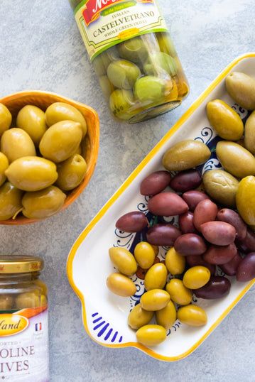 Here Are The Best Olives For Your Cheese Board – Giadzy Olives For Charcuterie, Olive Bar, Giada Recipes, Marinated Mushrooms, Gorgonzola Cheese, Italian Meats, Greek Olives, Charcuterie Cheese, Feed A Crowd