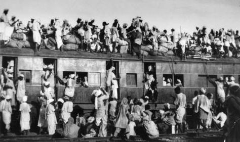 FILE - In this Sept. 19, 1947 file photo, Muslim refugees sit on the roof of an overcrowded train near New Delhi as they try to flee India. In the partition of the subcontinent into India and Pakistan after gaining independence from Britain in 1947, an estimated 1 million Hindus, Muslims and Sikhs were killed in rioting, and 12 million were uprooted from their homes. (AP Photo) 1947 India, भारतीय इतिहास, Human Migration, Mass Migration, Muhammed Ali, India Independence, Uk Universities, History Of India, India And Pakistan