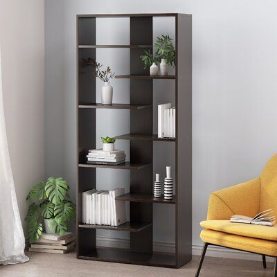 Latitude Run® Display your favorite books and a slim vase or two atop the generous shelving space their bookcase provides. Showcasing a sleek modern design, this bookcase features a staggered shelf structure for an eye-catching look. This etagere piece offers seven alternating half shelves, creating a durable construction that offers an open and unique look for any interior space. Finished with a smooth wood look, this piece not only provides ample organizational space but also complements your Modern Bookcase Design, Slim Vase, High Shelf, Office Bookcase, Etagere Bookcase, Teen Bedding, Bookcase Storage, Open Shelves, Mudroom Furniture