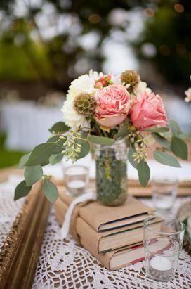 Graduation Centerpieces--not the flowers, but I like the idea of using craft paper-covered textbooks as "risers" for trays and such. Book Centerpiece, Books And Flowers, Book Centerpieces, Graduation Dinner, Graduation Open Houses, Graduation Tables, Graduation Theme, Shabby Chic Wedding, Diy Centerpieces