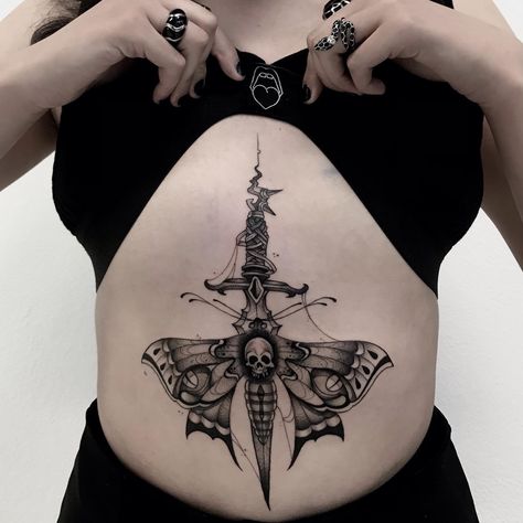 15+ Dagger Tattoos That Will Set Your Heart Aflutter - 100 Tattoos Sternum Heart Tattoo Women, Dagger Tattoo Sternum, Heart Sternum Tattoo, Dagger Back Tattoo, Dagger Chest Tattoo Female, Dagger Chest Tattoo, Dagger Sternum Tattoo Women, Dagger Sternum Tattoo, Dagger Thigh Tattoo