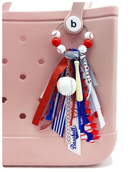 PRICES MAY VARY. ⚾ Elevate Your Style with Sporty Glamour: Our Bogg Bag accessory combines a trendy tassel crafted from different ribbons, a soccer charm, and eye-catching wooden beads. This handmade bogg bag charm instantly adds a touch of sporty glamour to any bag, making heads turn wherever you go. 💯 Premium Quality Craftsmanship: Our handmade Bogg Bag Charm is meticulously crafted using high-quality materials and detailed workmanship. From the intricately designed tassel to the durable base How To Make Bogg Bag Tassels, Bogg Bag Charms, Bogg Bag Accessories, Team Mom Baseball, Tote Bag Accessories, Baseball Accessories, Football Diy, Cheer Bag, Tassel Crafts