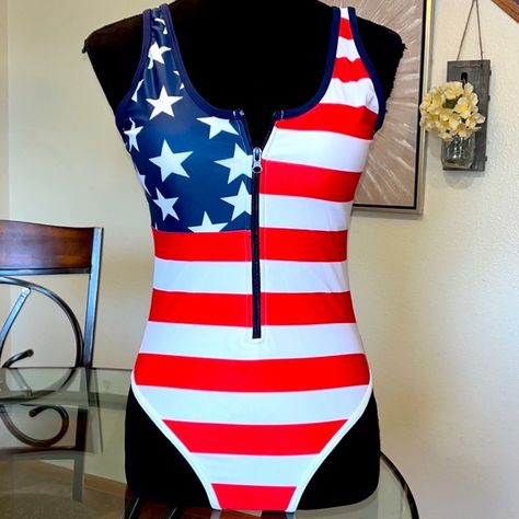 American Flag 1/2 Zip One Piece Swimsuit Show Off Your Patriotism Celebrate Independence Day With This One Piece American Flag Swimsuit! It Is A High Stretch Material, Lined Suit With Removable Padding Along With Zipper In Front. This Suit Is Not Cheeky, It Covers Really Well. Thick, Soft And Stretchy. Very Good Material, Well Made. 82% Polyester & 18% Elastane Please Message Me With Your Questions And Thanks For Looking! 2-3 Day Shipping Usps Priority Mail American Flag Swimsuit, One Piece Swimsuit Flattering, Board Shorts Women, Swimsuits Athletic, Rash Guard Swimwear, Flattering Swimsuits, Black One Piece Swimsuit, Striped One Piece, Tankini Swim Tops