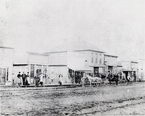 SEDALIA, PETTIS COUNTY, c. 1861.  	Sedalia appeared on paper as Sedville in November 1857 when George R. Smith filed a town plat.  It was not until October 1860 that Smith and David W. Bouldin filed the plat for Sedalia and began to build up the town.  As the terminus of the Missouri Pacific Railroad from January 1861 to late 1863, the town quickly grew into a city that housed Union troops throughout the Civil War. [SHS of MO-Columbia Photo Collection #026099] Sedalia Missouri, History Of Science, A Town, In November, Main Street, Photo Collection, Geography, Missouri, Columbia