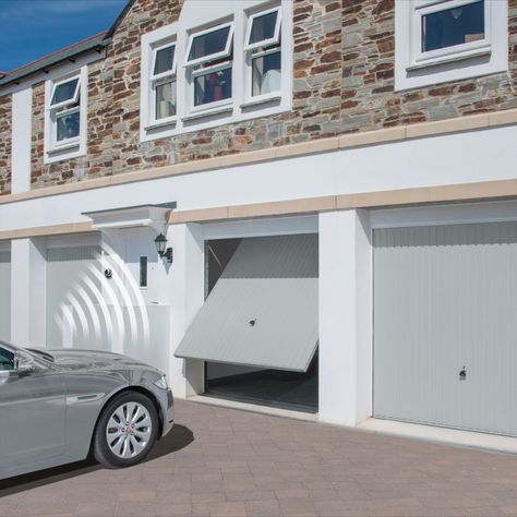 The Garador Carlton, shown here in Light Grey (RAL 7035), is a steel up & over garage door with a low maintenance and easy to clean design. Available with canopy and retractable gearing and also comes in a selection of 19 colours Garage Door Colours, Garage Doors Uk, Over Garage Door, Steel Garage Door, Ral Colours Grey, Garage Door Colors, Door Colour, Steel Garage Doors, Steel Garage