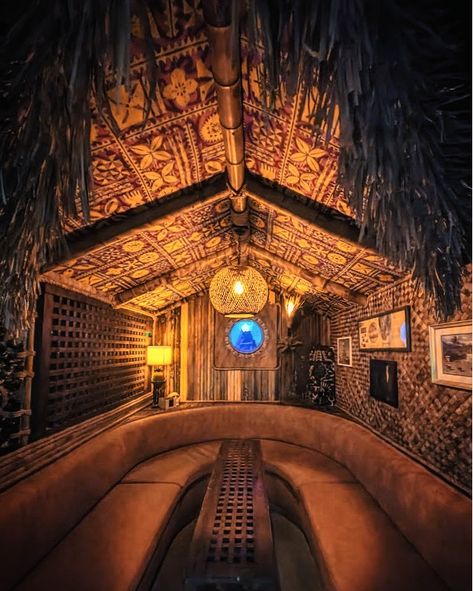 🌴🍹 Weekend Vibes: The Ultimate Tiki Speakeasy Hunt in Galveston! 🍹🌴 Ready for a weekend adventure with a tropical twist? 🌺 Hidden away, behind an unassuming door, lies a paradise of tiki cocktails and island vibes. Pineapple Parlor is THE place to escape reality and dive into a world of exotic flavors and cool, retro decor. Why You’ll Love It: 🍍 Craft Cocktails: Sip on expertly crafted tiki drinks that transport you straight to the islands. 🎶 Chill Tunes 🌺 Ambiance: The decor is a visua... Dark Tiki Aesthetic, Tropical Speakeasy, Tiki Aesthetic, Pirate Bar, Pub Ideas, Man Cave Pub, Mysterious Island, Bar Build, Tiki Style