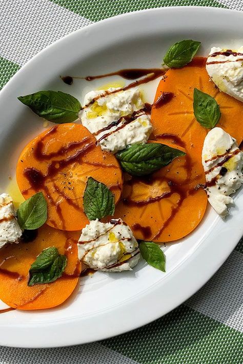 This Fuyu persimmon and burrata caprese salad is a quick and easy salad recipe! Make the best fall salad using Fuyu persimmon, burrata cheese, balsamic glaze, and basil. You will love serving this persimmon recipe as a fall side dish! Burrata Caprese Salad, Fuyu Persimmon, Burrata Caprese, Salad Photo, Burrata Recipe, Persimmon Recipes, Cornbread Salad, Winter Salad Recipes, Burrata Salad