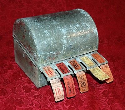 This is a 5-roll vintage ticket dispenser made by the Globe Ticket Company of Philadelphia, PA. The box is made of metal and weighs about 3 pounds. The outside of the box has corroded over the years Ticket Dispenser, Ticket Machine, Theater Ticket, Vintage Movie Theater, Old Medicine Bottles, Ticket Booth, Vintage Ticket, Vintage Theatre, Master Board