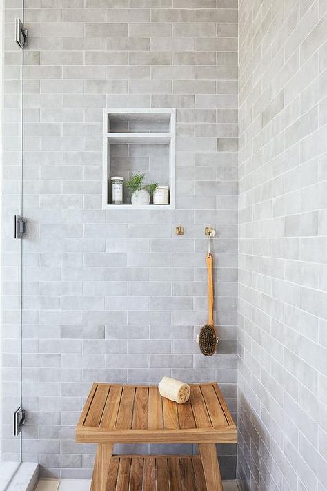 Bathroom features shower with gray glazed subway brick tiles, a gray tiled shower niche and a teak shower bench. Pool House Bathroom, Brick Bathroom, Tile Shower Niche, Gray Shower Tile, Subway Tile Showers, Teak Shower Bench, Glazed Brick, Teak Bench, Cottage Bathroom