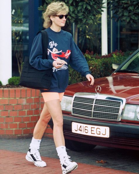 It's officially that time of year: Princess Diana outfit season. The sun is shining and there's a slight chill in the air which means it's the perfect time to pull out your favorite crewneck sweatshirt and a pair of biker shorts inspired by the queen of transitional style. At the link in bio, how to recreate her iconic look. Ugly Shoes, Biker Shorts, Transitional Style, Princess Diana, Winter Collection, Trending Shoes, Being Ugly, Crew Neck Sweatshirt, Crew Neck