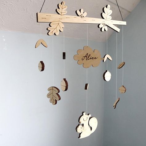 Featuring a personalised leaf, our little squirrel mobile is lovingly hand made from 3mm Birch, measuring 35cm wide by roughly 43cm in height. All name mobiles come presented in a beautiful Fred & Robin giftbox. Please note, this is not a toy and is intended for decorative purposes. Wooden Baby Mobile, Woodland Nursery Boy, Woodland Animals Theme, Woodland Mobile, Scandi Nursery, Magical Gifts, Wood Nursery, Wood Burning Crafts, Magical Gift