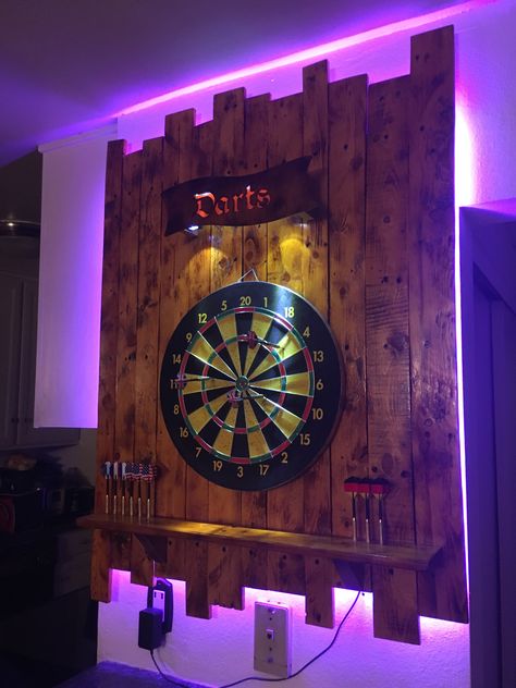 Dartboard backboard with backlight and Darts sign Home Bar Designs Man Caves, Dartboard Backboard, Dart Board Backboard, Basement Game Room Ideas, Dart Board Wall, Bar Deco, Ultimate Man Cave, Man Cave Room, Game Room Basement