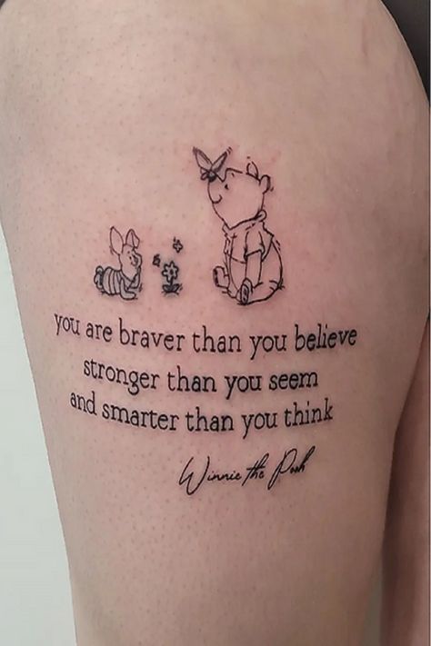 The tattoo you’ve shared features characters from Winnie the Pooh, specifically Winnie the Pooh and Piglet. The text below them reads: “you are braver than you believe, stronger than you seem, and smarter than you think.” This quote is attributed to Winnie the Pooh and serves as a message of self-encouragement and belief in one’s inner strength and intelligence. The butterfly above the characters adds a touch of whimsy. Tattoos often hold personal significance. Braver Than You Believe Quote Tattoo, You Are Braver Than You Believe Tattoo, Eore Winnie The Pooh Tattoos, Tattoo Ideas Winnie The Pooh, You Are Stronger Than You Think Tattoo, Winnie The Pooh Quotes Tattoo, Pooh Bear Tattoo Ideas, Disney Tattoos Small Meaningful, Piglet Tattoo Ideas