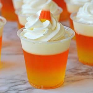 Candy Corn Jello Shots - Balancing Motherhood Candy Corn Jello, Candy Corn Desserts, Candy Corn Jello Shots, Halloween Jello Shots, Halloween Jello, Fun Halloween Treats, Fun Halloween Food, Halloween Treats Easy, Fall Snacks