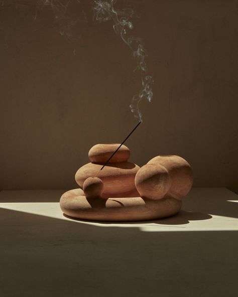 A curvaceous terracotta form inspired by the at-times weird and wonderful shape of flowers. Designed for a practical purpose as a vase and incense holder, it can also sit on its own as a sculptural piece.  #terracotta #vase #terracottavase #incenseholder #clayvase #interiordesign #interiordecor #interiorstyling #interiordesigninspo #architecture Terracotta Design, Terracotta Vase, Artistic Installation, Clay Vase, Wall Finishes, Weird And Wonderful, Incense Holder, Bed Storage, Market Design