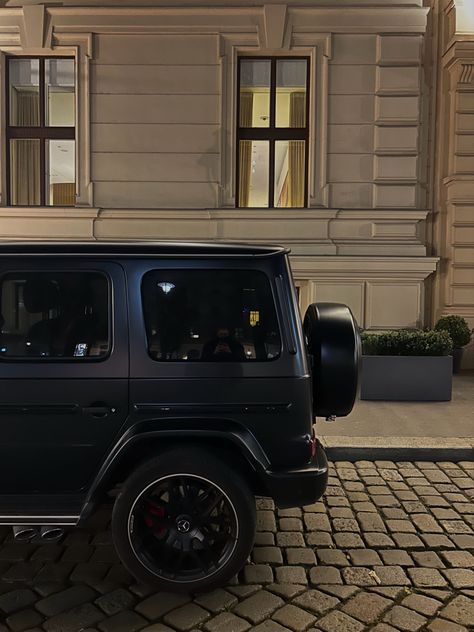 A black mercedes g wagon in front of the Ritz-Carlton in Vienna Austria G Wagon Interior Aesthetic, Black G Wagon Aesthetic, Aesthetic G Wagon, Mercedes G Wagon Aesthetic, G Wagon Black, G Wagon Aesthetic, World Expensive Car, Expensive Aesthetic, Black G Wagon