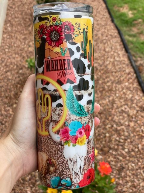 Western tumbler #callawaycups #custom #customtumblers #western #cowskull #flowers #tumbler #koozie #hisandhers #summercups #resin #epoxy #epoxytumbler Western Tumbler Cups Boho, Rodeo Tumbler Ideas, Western Cup Designs, Western Tumbler Cups, Western Tumbler Ideas, Country Cups, Western Tumblers, Water Bottle Ideas, Cowgirl Room