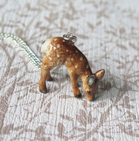 This stunning baby deer pendant is made from porcelain and is hand painted, then coated in a ceramic glaze.  Each pendant comes with a sterling silver plated chain which measures approximately 60.96cm/24" and comes beautifully presented in a gift box.   The pendant itself measures approximately 2.6cm/1.02inches in width x 2.3cm/0.91inches in height. PLEASE NOTE: Each pendant is made from porcelain which is delicate and should be handled with care. It is not advisable for them to be worn when sle Deer Necklace, Spiritual Animal, Porcelain Animal, Animal Pendant, Ceramic Glaze, Baby Deer, The Hope, Silver Plated Jewelry, Animal Jewelry