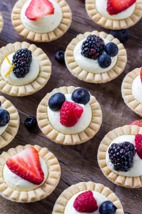 Flaky pastry, sweet vanilla filling, and fresh berries come together to make these adorable mini fruit tarts. It's a super easy recipe because we're using frozen tart shells, then the filling is a deliciously fluffy vanilla cream made with pudding mix. #tarts #fruittarts #minidesserts #recipes #berries Sugar Cookie Fruit Tart, Fruit Tart Recipe Mini, Frozen Tart Shells, Fruit Tart Filling, Tart Shells Recipe, Mini Tart Shells, Fruit Sugar Cookies, Mini Tart Recipes, Pudding Tart