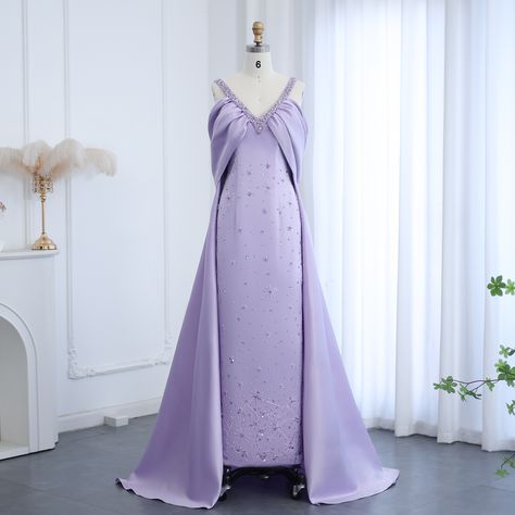 Search:SS341 https://www.dreamyvow.com/products/dreamy-vow-arabic-lilac-off-shoulder-lilac-evening-dress-with-cape-overskir-luxury-dubai-beaded-women-wedding-party-gowns-ss341-1?_pos=1&_psq=SS341&_ss=e&_v=1.0 #ElegantDress #Dubai #WeddingGuest #FashionGoals #DubaiStyle #EveningGown #couturedress #formaldress #wedding #guest #luxurywedding #summerwedding #couture #weddingdress #eveningdress #فساتين_زفاف #الامارات #فساتين_سهره #düğün #nişanelbisesi #bridalcouture #dreamweddingdress #bridetobe #... Overskirt Dress, Evening Dress With Cape, جزر المالديف, Yellow Evening Dresses, Grey Evening Dresses, Champagne Evening Dress, Dress With Cape, Gold Evening Dresses, White Evening Dress