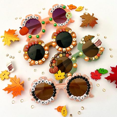 "The cutest Fall Style Sunglasses for kids  These are Absolutely adorable! Each pair is designed & handmade by me; Using various beads, Rhinestones, and charms.  So much fun for so many occasions... whether it's photoshoots, parties, pumpkin patches, Birthdays, or just for fun! These also make the BEST GIFTS!! 😊 HOW TO ORDER: *Choose your style-- STYLES AVAILABLE: 1. PUMPKIN SPICE CUTIE  2. SPICE GIRL 3. ITS FALL YALL 4. PUMPKIN PATCH CUTIE * Anti-Glare * UV Protection (UVA & UVB) * Durable and shatterproof * They open and close smoothly *Each item is made to order and will be ready to ship in 5-7 business days! If you need your order sooner. Please check out my \"RUSH ORDER OPTION\". https://www.etsy.com/EyeCandyandFluff/listing/1286351273/rush-my-order-please *SHOP DISCLAIMER/WAIVER if Diy Kids Sunglasses, Diy Sunnies, Fall Craft Kids, Christmas Shoes Diy, Weaving Beads, Fall Craft Fairs, Diy Sunglasses, Girls Sunglasses, Fall Sunglasses