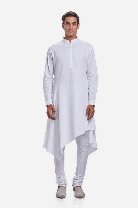 The New Age Indian Menswear; this classic kurta is rendered in cotton. Punctuated with an asymmetric draped hemline, the overall fit streamlines the form. Finish with a classic white churidar and velvet loafers #GauravGupta #GauravGuptaMan #GGMan #MensFashion #Menswear #Kurta #Draped Trendy Kurta For Men, Men Daily Outfit, Angarkha Kurti Pattern, Angarkha Kurti, Menswear Kurta, Kurta Ideas, Indian Menswear, Mens Pattern, White Churidar