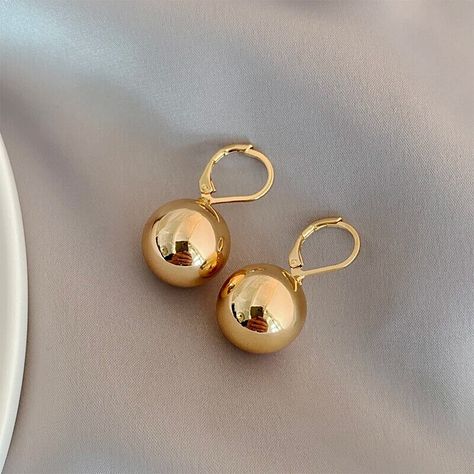 Get ready to shine with Styleinger's Simple Metal Smooth Ball Pendant Earrings! Perfect for any occasion, these fashion-forward dangle earrings feature a round shape and enamel and metal material. With a bezel setting style and trendy tassel design, you'll be the life of the party. Shop now! #Styleinger #FashionJewelry #DangleEarrings #TasselStyle #Enamel Unique Gold Earrings, Ball Drop Earrings, Daily Wear Jewellery, Ball Drop, Ball Pendant, 2024 Fashion, Stunning Earrings, Party Shop, Pendant Design