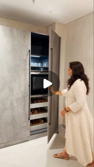 ELLE DECOR India on Instagram: "Space is an eternal constraint in a modern city home, but you don’t have to compromise on convenience or comfort anymore! Conceal large appliances with these clever Pocket Door Cabinets from Häcker Kitchens @hackerkitchensindia . The retractable doors can be pushed in and hidden into the sides of the cabinet to create instant open shelving. The doors slide out to quickly and easily hide the contents of the cabinet — the perfect spot for big appliances like ovens and microwaves or for a home bar that can be opened when socialising or be transformed into a cosy coffee station or a pantry. This flexible solution has a variety of uses making it a popular choice.⁠ ⁠ Visit @hackerkitchensindia to explore their German-made modular kitchens.⁠ ⁠ Showrooms in 16 citie Microwave In A Pantry Cabinet, Slide And Hide Oven, Retractable Kitchen Cabinet Doors, Slide And Hide Kitchen Doors, Kitchen Cabinet Hidden Door, Sliding Doors Hidden Utility, Oven Microwave Cabinet, Microwave And Coffee Station, Lcd Panel With Hidden Door