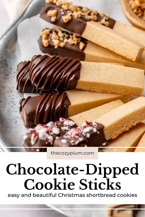 These easy cookie sticks have a tender shortbread base with a snap that’s satisfying to bite into and are dipped in your favorite chocolate and decorated with festive sprinkles, nuts, or candies. If you’re looking for a crisp, buttery cookie for your Christmas cookie box that’s both eye-catching and delicious, these aesthetic Christmas shortbread cookies are just what you need! Christmas Sprinkles Cookies, Easy Christmas Shortbread Cookies, Pretzel Shortbread Cookies, Turtle Shortbread Cookies, Chocolate Covered Shortbread Cookies, Shortbread Stick Cookies, Shortbread Dipped In Chocolate, Chocolate Spritz Cookie Recipe, Cookie Sticks Decorated Christmas