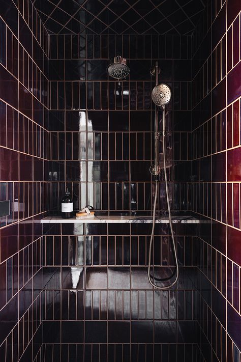 Primary bathroom/master bathroom shower designed in dark and moody aesthetic. Burgundy gloss shower tile with brass shower fixtures and marble stone shower shelf. Jean Stoffer Woodward, Established Home Jean Stoffer, Stoffer Home Bathroom, Primary Bathroom Ideas 2023, Jean Stoffer Bathroom, Speakeasy Bathroom, Colour Bathroom, Small Dark Bathroom, Burgundy Bathroom