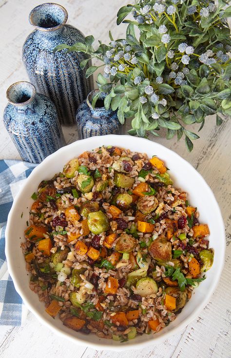 A combination of fall veggies are paired with farro in this hearty salad. Shaved Brussel Sprout Salad, Farro Recipes, Shaved Brussel Sprouts, Fall Veggies, Salad Inspiration, Potluck Dinner, Harvest Salad, Pumpkin Cranberry, Farro Salad