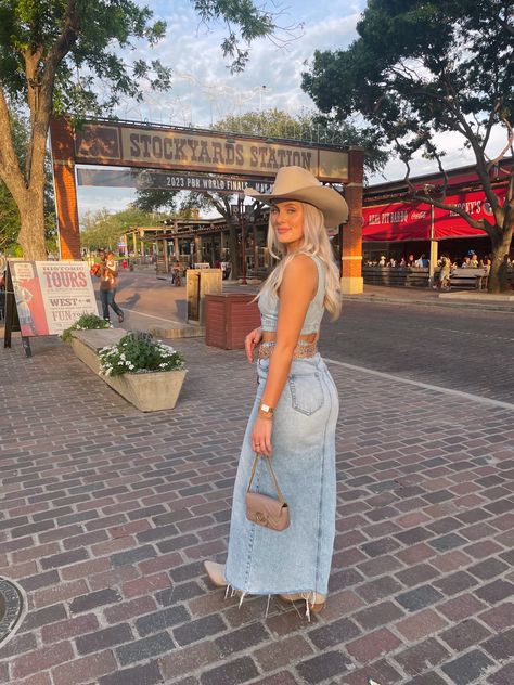 Rodeo Outfit Western Outfit Denim Maxi Skirt Cowgirl Hat Cowgirl Boots Gucci Purse Western Belt Dallas Fort Worth Texas Stockyards Stockyards Outfit Summer, Casual Cowgirl Hat Outfit, Satin Skirt With Cowgirl Boots, Rodeo Outfits Denim Skirt, Dallas Stockyards Outfits, Jean Skirt With Boots Outfit, Denim Cowgirl Boots Outfit, Denim Skirt With Cowgirl Boots, Bone Cowboy Boots Outfit