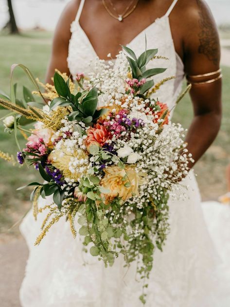 The ultimate wedding flower ideas based on your relationship! If you’re an adventurous couple or always seeking to vacation in exotic locations, wildflowers are the wedding blooms for you! Work with your florist to source in-season blooms like cornflowers, poppies, daisies, daffodils and violets. Weave in airy stems of baby's breath and greenery leaves to add texture and dimension. Sparkly Wedding Cakes, Fairytale Wedding Theme, Wildflower Wedding Bouquet, Cascading Bridal Bouquets, Cascading Wedding Bouquets, Wedding Flowers Summer, Cascade Bouquet, Wedding Inspiration Summer, Fall Wedding Bouquets