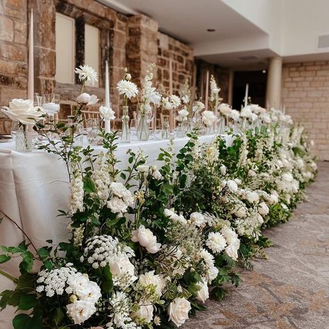 Rosy Lea Florist on Instagram: "Meadows upon meadows of White Ohara, Tuberose, dahlia, larkspur and an abundance of locally grown foliage & ammi ✨ the scent coming from these guys! All repurposed beautifully in front of the top table, around the cake table and in front of the gift card table. Perfect 🤍" Flower Meadows Wedding, Wedding Top Table Flowers, Top Table Flowers, Wedding Top Table, Kings Table, White Flower Arrangements, Floral Runner, Reception Inspiration, Wedding Cake Table