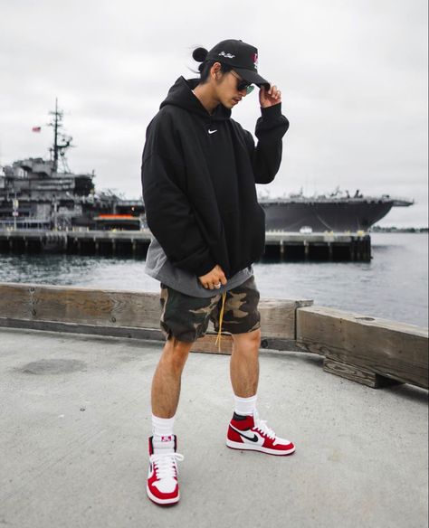 Large hoodie paired with camo shorts and Air jordans 1 mid sneakers Mens Shorts And Hoodie Outfit, Air Jordan Summer Outfit, Air Jordans Outfit Men, Style Jordan 1 Men, Jordan 1 With Shorts, Air Jordan 1 Mid Outfit Man, Jordan High Outfit, Air Jordan 1 Outfit Men Fashion Styles, Shorts And Jordans Outfit