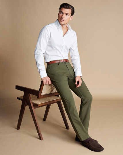 Twill 5 Pocket Jeans - Stone | Charles Tyrwhitt White Shirt Green Pants Men, Olive Jeans Outfit Men, Men Olive Green Pants Outfit, Army Green Outfit Men, Olive Green Pants Outfit Men Casual, Olive Green Chinos Outfit Men, Green Pants Men Outfit, Light Green Pants Outfit Men, Mens Green Pants Outfit