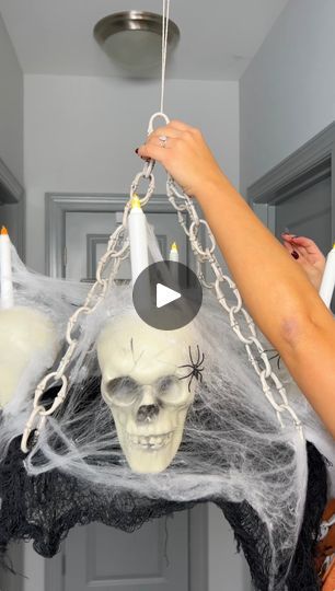 49K views · 517 reactions | Easy and affordable Halloween decoration for under $10 | Easy and affordable Halloween decoration for under $10

I made a spooky skull themed chandelier with a few plastic skulls, battery powered candles, and... | By Cirqnamics | Wow. There you have it you
guys. I think this was all under $10. All in the dollar
store. Everything was a dollar or something. So let's turn off
our working lights over there and see it groomy. Alright you
guys. There you go. Oh my god. How spooky is that? Super easy.
So good. Super budget friendly. And so ready to spook your
guests. Wow. And it's spinning with pure magic just so you
know. There's no motor. Good job. Thank you. Battery Powered Candles, Just So You Know, Good Job, Dollar Stores, Budget Friendly, Halloween Decorations, Turn Ons, Candles, Pure Products