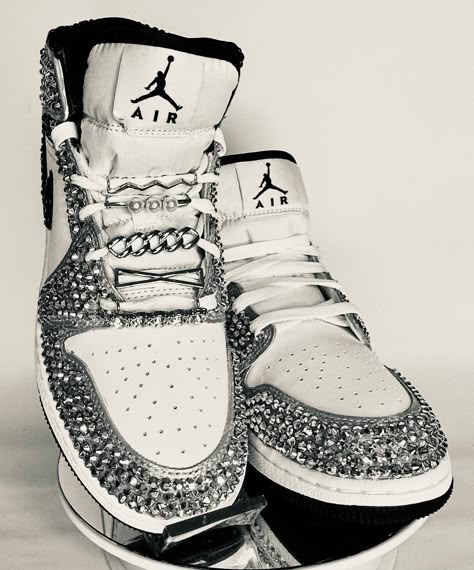 Take your Jordans to the next level by adding some bling! These shoes are a great addition for prom, birthday, wedding, night on the town, or your  next event! These shoes can be customized to the colors or your choosing. This listing is for a  bedazzled shoe in the areas as shown. If you would like a fully blinged shoe that includes the toe box and sides, please see the listings that start with, "Fully Blinged".   Not looking for Jordan 1's Mids? Message me with your shoe choice. I'd love to create the custom shoe of your dreams.   Please note, the shoe lace charms are an additional charge starting at $7 per pair.  *Disclaimer We are not associated with the brand, I only hand customize the shoes using rhinestones. Bling Jordans, Bedazzling Shoes, Prom Sneakers, Bedazzled Sneakers, Sparkly Sneakers, Cute Jordans, Rhinestone Sneakers, Lace Charms, Jordan 1 Mids