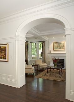 Love it!  Arched doorway and high chair rail. Gorgeous! #eclecticstylebedroom Entrance Halls, Hallway Entrance, Arch Doorway, Planning Board, Gorgeous Houses, Foyer Decorating, Storey Homes, Hamptons Style, Entry Hall