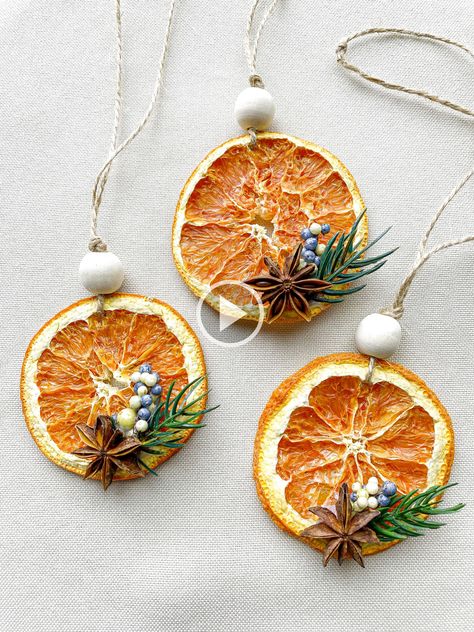 + + "These ornaments are made with a dehydrated orange slice...al star anise...d artificial evergreen twig and blue berries. It is strung on rustic jute twine with a wooden bead. Unlike many others... use Cara Cara oranges since they retain their vibrant orange color better than typical navel oranges. If it is kept in a cool dry place...e orna! Japandi Christmas, Dried Orange Ornaments, Sustainable Christmas Decorations, Scandinavian Christmas Ornaments, Yule Celebration, Orange Ornaments, Blue Christmas Ornaments, Minimalist Christmas Decor, Hygge Christmas