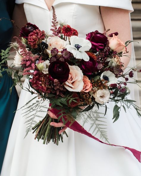 Winter Brides & Grooms – Your Season Has Arrived! ❄️✨ As December begins and the festive spirit fills the air, we’re reminiscing about Andrew & Annabel’s magical February wedding at Farnham Castle, Surrey. Annabel’s bouquet was simply stunning! Wrapped in lush silk ribbon, it featured a cozy mix of deep reds, burgundies, maroons, neutrals, and ivory—a perfect reflection of the season's beauty. A stunning ceremony arch framed their intimate ceremony and later appeared outside the reception ... Burgundy And Green Bouquet, Wedding Flowers Winter Bouquets, Toffee Wedding Bouquet, Cream And Red Wedding, Maroon Wedding Flowers, Blush And Maroon Wedding, Ranunculus Bouquet Wedding, December Wedding Flowers, February Wedding Flowers