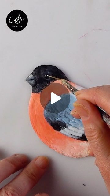 AB Creative on Instagram: "QUICK + EASY 3D Bullfinch Tutorial! 🐤 I used Glue Gun, Texture Paste and FIMO to make it! Let me know what you thought in the comments ❤️ 
The FULL Tutorial is linked in Bio + Story OR Search for AB Creative on YT ▶️!
.
This piece is available to purchase at: www.abcreativeofficial.com" Clay Candle, Bullfinch, Paint Pouring, Texture Paste, Painting Lessons, March 1, Glue Gun, Texture Art, Art Techniques