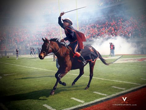 University of Virginia Cavaliers. The mascot is a historical reference to the time when the Commonwealth of Virginia earned its nickname, the "Old Dominion." The Commonwealth was a hotbed of persons loyal to the English crown, called cavaliers in the days of the English Civil War. Cavaliers Wallpaper, Referee Costume, Horse Costumes, Virginia Cavaliers, Virginia Tech Hokies, Visit Usa, Old Dominion, University Of Virginia, Sports Wallpapers