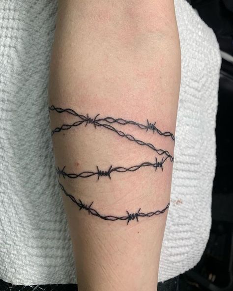 Barb Wire Wrap Around Tattoo, Barbed Wire Tattoo Around Wrist, Barbwire With Flowers Tattoo, Forearm Barbed Wire Tattoo, Barbed Wire Tattoo Around Leg, Barbwire Forearm Tattoo, Barbwire Tattoo Around Leg, Barb Wire Tattoo Around Arm Men, Barbed Wire Bicep Tattoo