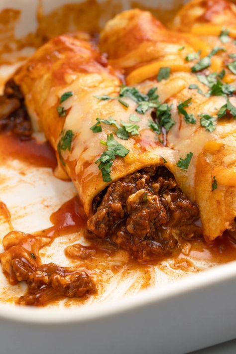 This easy ground beef enchiladas recipe takes simple ingredients and transforms them into delicious enchiladas smothered in sauce and cheese. Beef Enchiladas With Red Sauce Authentic, Ground Beef Enchiladas With Red Sauce, Meat Enchiladas, Beef Enchiladas With Red Sauce, Easy Ground Beef Enchiladas, Cheese Wallpaper, Mexican Ground Beef Casserole, Beef Enchiladas Recipe, Enchiladas Recipes